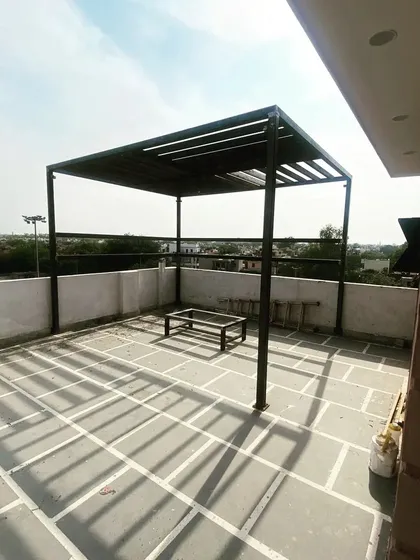 A newly installed MS pergola on a client's terrace. This structure is the foundation of a complete terrace makeover, ready for lighting, seating, and plants.