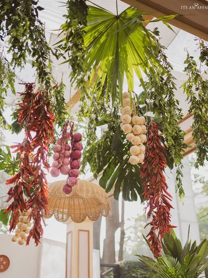 Hanging braids of garlic, onions, and chilies add an authentic and aromatic touch to the farmers market theme.