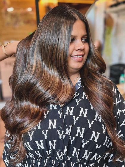 A beautiful global color base with balayage highlights and a trendy multilayer haircut. We used Olaplex to keep the hair healthy and vibrant throughout the coloring process.