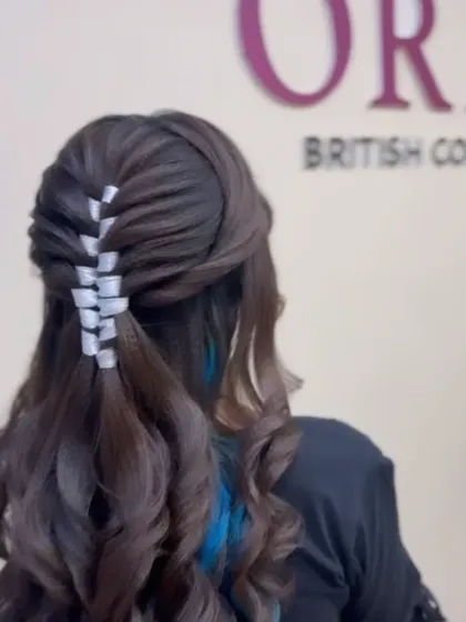 A closer view of the intricate ribbon weaving technique taught in our hairstyling classes.