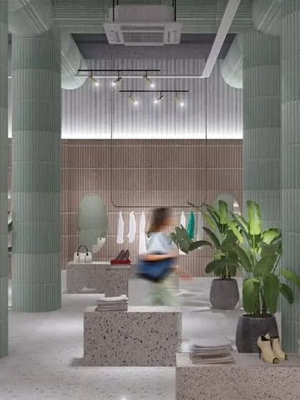 A view of the GRASSROOT retail floor. We designed the space with high ceilings and wide, open pathways to make shopping feel unhurried and expansive. The minimal display units put the focus squarely on the products.