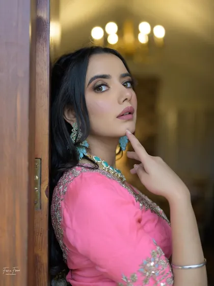A close-up of this soft glam look. The focus is on her beautiful features, enhanced with subtle makeup.