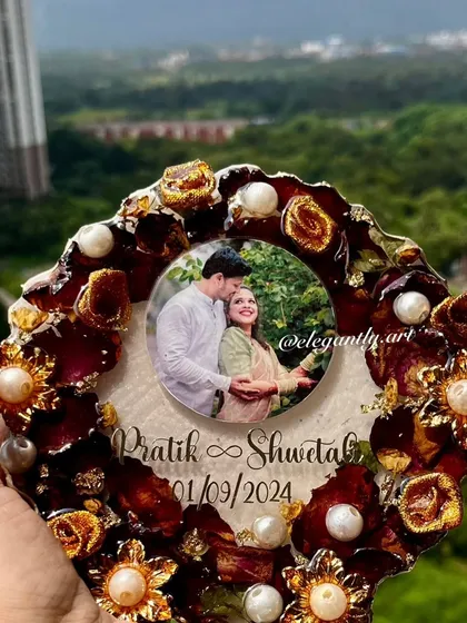 This 6-inch budget-friendly photo frame is held against a beautiful outdoor backdrop, showing how the preserved flowers and couple's photo create a stunning keepsake.
