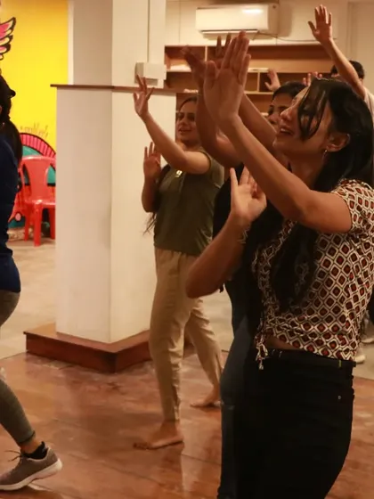 Students practicing the moves with full concentration and big smiles. This is the joy of dance.
