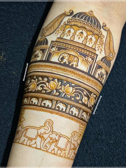 The design in its early stages, showing the outline of the palace and elephant procession. This highlights the careful planning that goes into each complex piece.