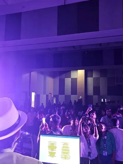A view from the stage of the energetic crowd at the ITC Infotech corporate event.