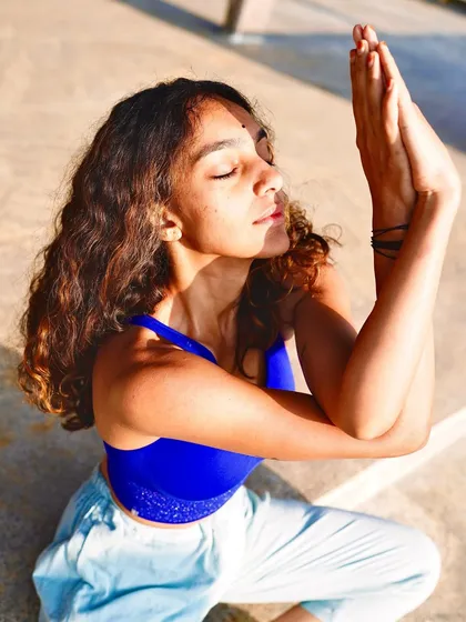 In Garudasana arms, I embody the feeling of being a thread in a single tapestry. We are all different notes in the same melody, walking each other home.