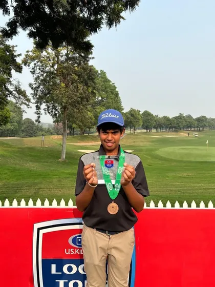 Rayirth with his medal from one of his many podium finishes during the USKids fall season.