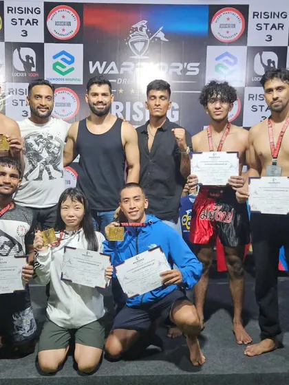 The full team, including coaches and fighters, posing with their certificates and medals. This represents the huge effort from everyone involved, from training partners to the athletes themselves.