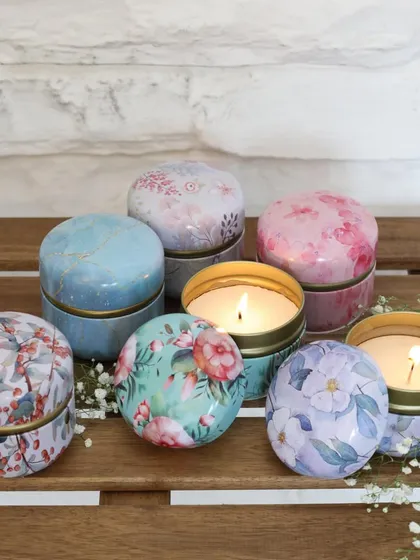 A collection of our travel-sized floral tin candles. These are perfect for creating a cozy atmosphere anywhere, or for use as charming party favors.