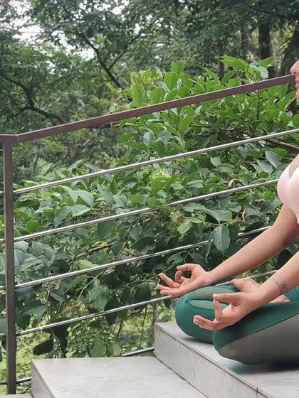 Finding stillness in Padmasana, or the lotus pose, surrounded by nature. This is the heart of my practice, connecting with my breath to find clarity and calm. We end our sessions with meditation and Yoganidra to help you find this same peace.