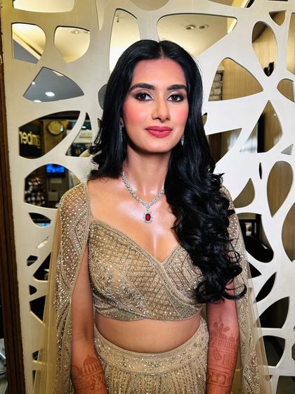 A confident look for a wedding guest. The makeup is glamorous, with a focus on the eyes, but still feels fresh and modern.