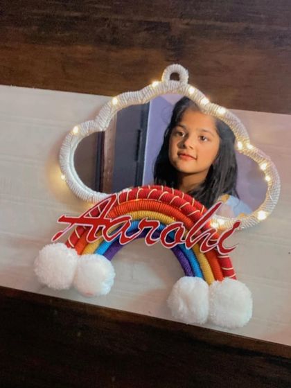 A happy customer with her personalized 'Aarohi' mirror. It's wonderful to see my creations being enjoyed.
