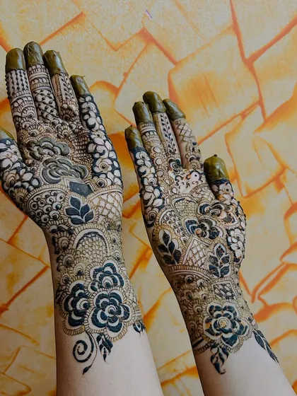 A full bridal henna design, packed with detail. I love creating these dense, traditional patterns that cover the hands and wrists, making sure every part of the design is sharp and meaningful for the bride's big day.