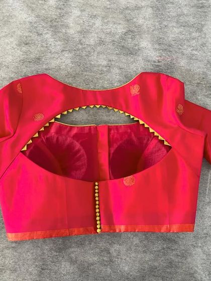 This blouse with a unique back cutout is an example of the trendy designs I can produce for your retail business. Let's work together on your next collection.