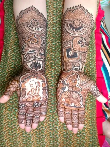 This design combines different figures. One palm features a woman in prayer, while the other has a majestic elephant, both surrounded by traditional patterns.