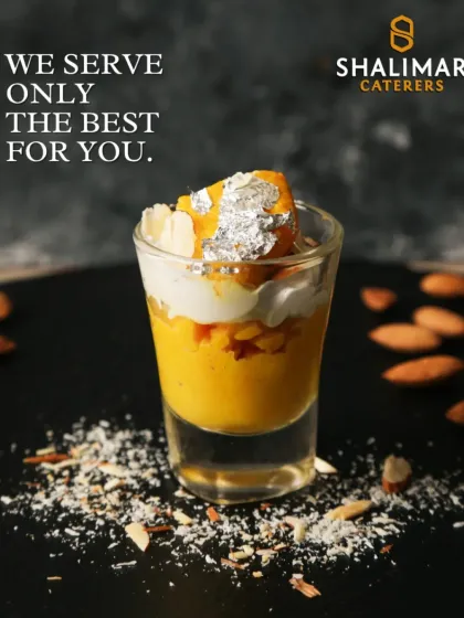 We serve only the best for you. This mango dessert shot, garnished with silver leaf, is a perfect example of our commitment to quality.
