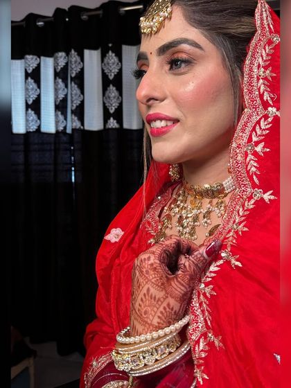 A side profile showcasing the flawless base and soft contouring. The makeup is designed to look perfect from every angle.