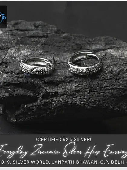 Another view of our everyday zirconia silver hoop earrings, showing the detail of the stones and the secure clasp mechanism.