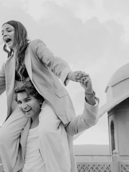 Pure, unscripted joy during a pre-wedding session in Jaipur. This candid black and white photo captures a playful piggyback ride, showing that the best moments are often the spontaneous ones.