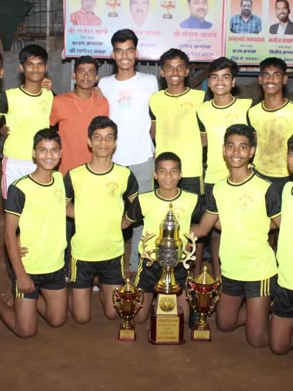 Our champion sub-junior team posing with their trophies on the Kabaddi mat.