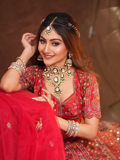 A happy, smiling portrait of the model, her makeup looking bright and beautiful.
