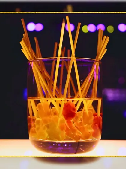 A fun and playful garnish using gummy bear candies on sticks. We love finding creative ways to make our drinks memorable and sweet.