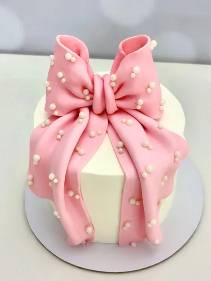 Why stop at wrapping the gift when the cake can come wrapped too? This elegant bow cake is ideal for bridal showers, birthdays, or any special moment.