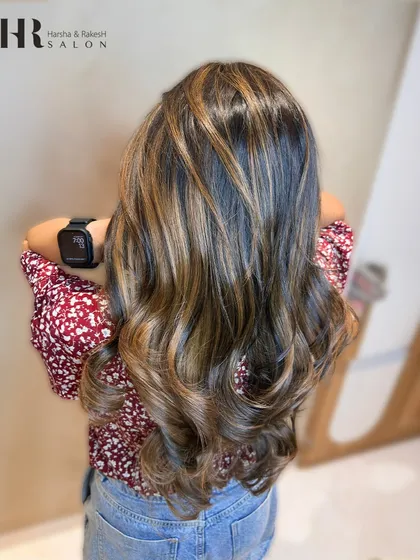 Another angle of the finished balayage, showcasing how the highlights are woven through the hair for a natural effect.
