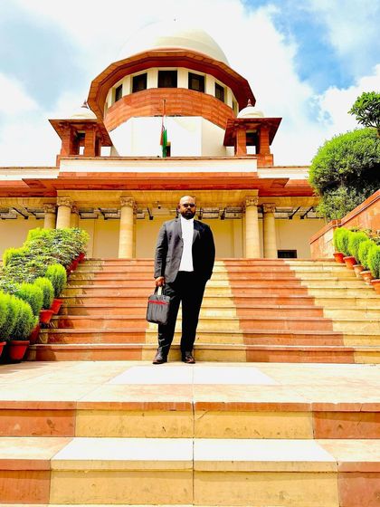 A solo shot on the steps of the Supreme Court.