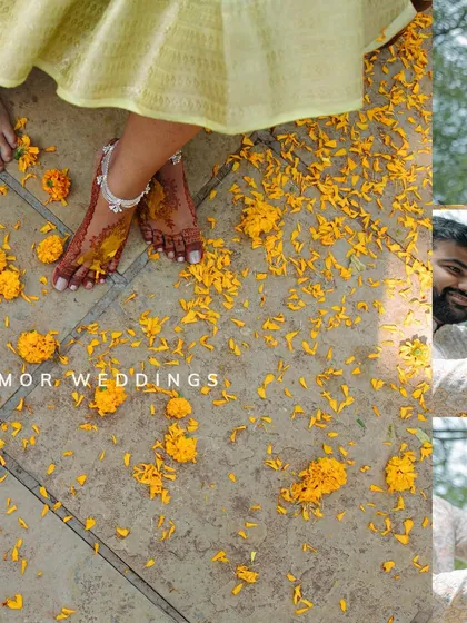 An artistic shot focusing on the details on the ground. The bride's feet, adorned with anklets and turmeric, surrounded by scattered marigold petals, makes for a beautiful composition.