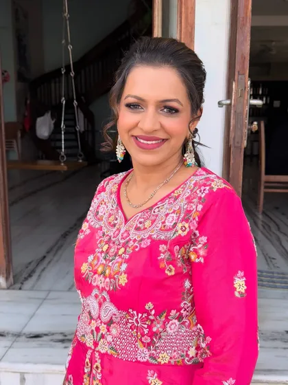 A beautiful, happy client photo. The makeup is fresh and radiant, perfect for a daytime wedding ceremony.