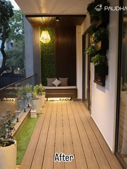 The magic of lighting. This is the 'after' view at night of the same balcony from our hero image. I used a combination of a statement pendant light, under-bench strip lighting, and spotlights on the plants to create a warm, inviting, and absolutely stunning ambiance. Your outdoor space should be beautiful 24/7.
