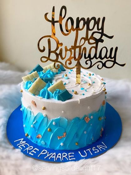 A custom blue and white cake with a personal message written on the board. I love adding these little details for my clients.