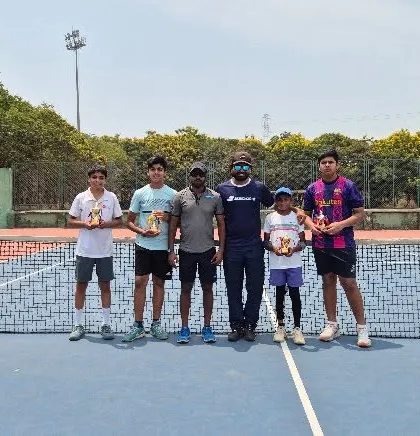 Our victorious players with their coach after a successful tournament at ASA Academy.