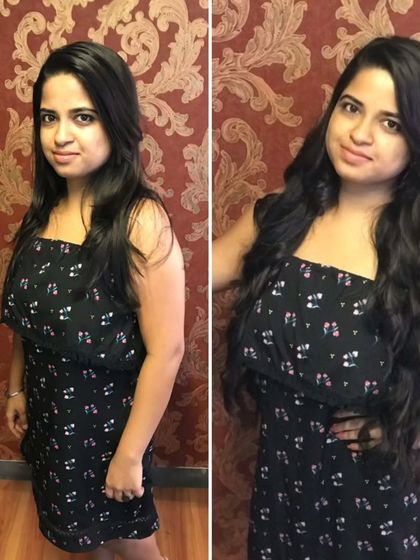 This client's hair was transformed with added length and beautiful, bouncy curls for a fun and glamorous new style.