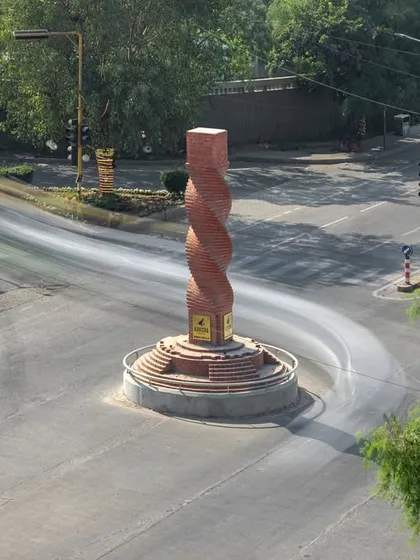 **The Urban Twist, Ahmedabad:** This landmark at a bustling crossroads is our modern interpretation of Ahmedabad's heritage. We used brick, a material deep-rooted in the city's history, and gave it a dynamic, contemporary spiral form to symbolize a city that is constantly evolving yet connected to its past.
