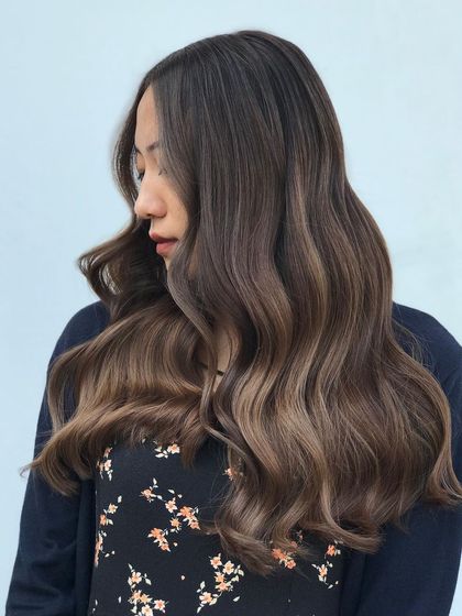 Another view of this beautiful signature balayage, showing the client's happy reaction. My goal is to create hair that not only looks good but feels good too.