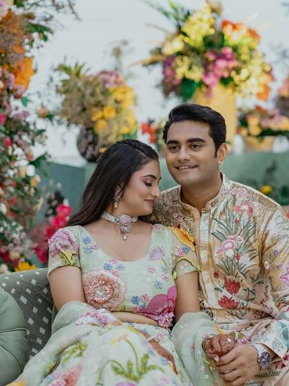 An intimate portrait of Shree and Mohnish. This photo showcases how their coordinated Rahul Mishra ensembles work beautifully together up close.