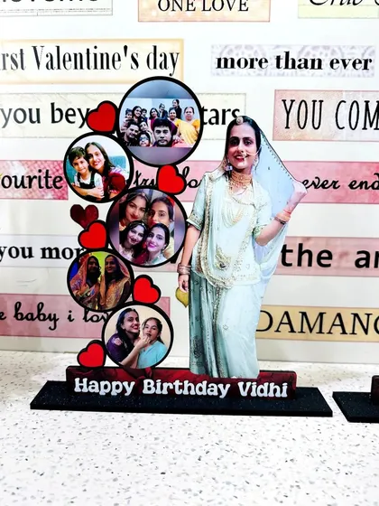This custom tabletop frame celebrates a birthday with a full-length photo cutout and a collection of memories with friends and family in circular frames.