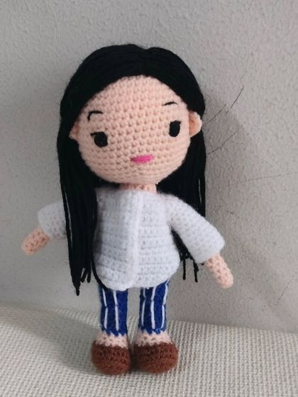 This doll is dressed in a modern white shirt and striped pants. I can make dolls in any style of clothing.