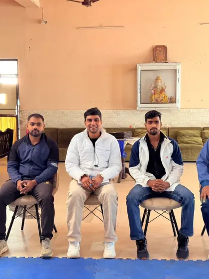 A formal moment during a coaches' meeting. We regularly gather to discuss training methodologies and the future of the sport.