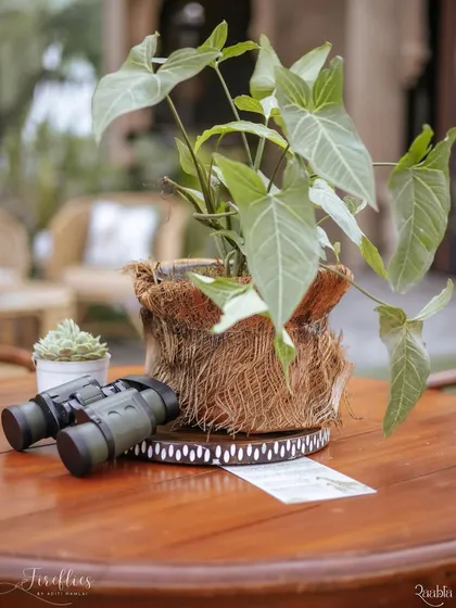 A pair of binoculars placed on a table as a prop for the safari-themed sundowner, inviting guests to immerse themselves in the spirit of adventure.