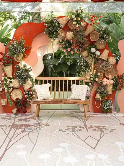 A sustainable and earthy boho-chic wedding stage. This design uses natural terracotta, handcrafted elements, and dried florals to create a warm, grounded, and beautifully unconventional setting.