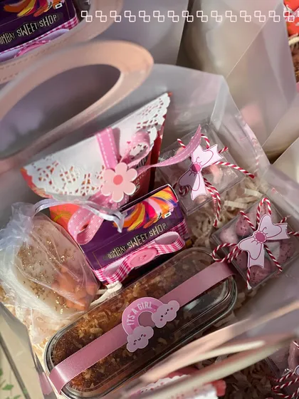 A look inside one of the announcement bags, showing the mix of tea cakes, chocolate barks, and other treats.