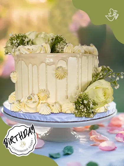 A graceful and elegant drip cake adorned with fresh white roses and baby's breath. This sophisticated design is perfect for a chic and modern celebration.