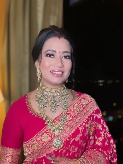 A smiling portrait of our reception bride, looking absolutely radiant and timeless.