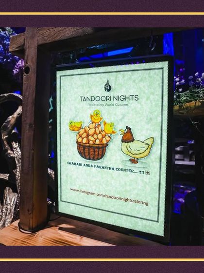 Our live stations offer creative and fun menus, like this sign for our "Shakari Anda Parantha Counter," a playful vegetarian take on a classic street food.