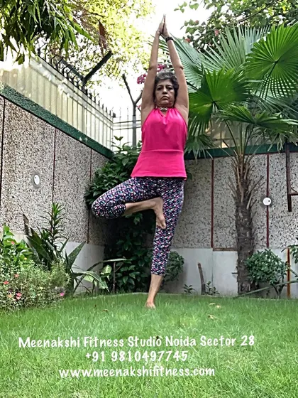 Practicing Vrikshasana, or Tree Pose, outdoors helps connect us to nature's stability. In my classes, we work on balance to build physical and mental steadiness for the changes pregnancy brings.