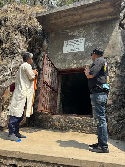 Praying at the entrance of Babaji's cave. It is a humbling experience to be at the source of a spiritual tradition that has transformed countless lives, including my own.